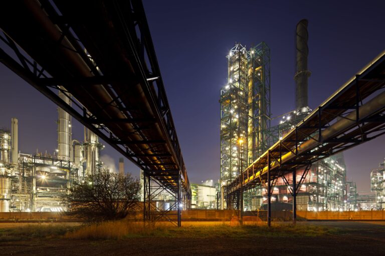 Level-2-Award-in-the-Principles-and-Practice-of-Process-Safety-Management-pipelines-and-refinery-at-night