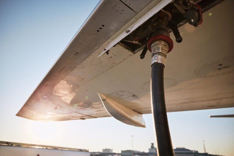 Refueling of airplane at airport. Ground service before flight.